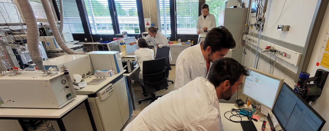 Students working in the lab using different IRMS techniques